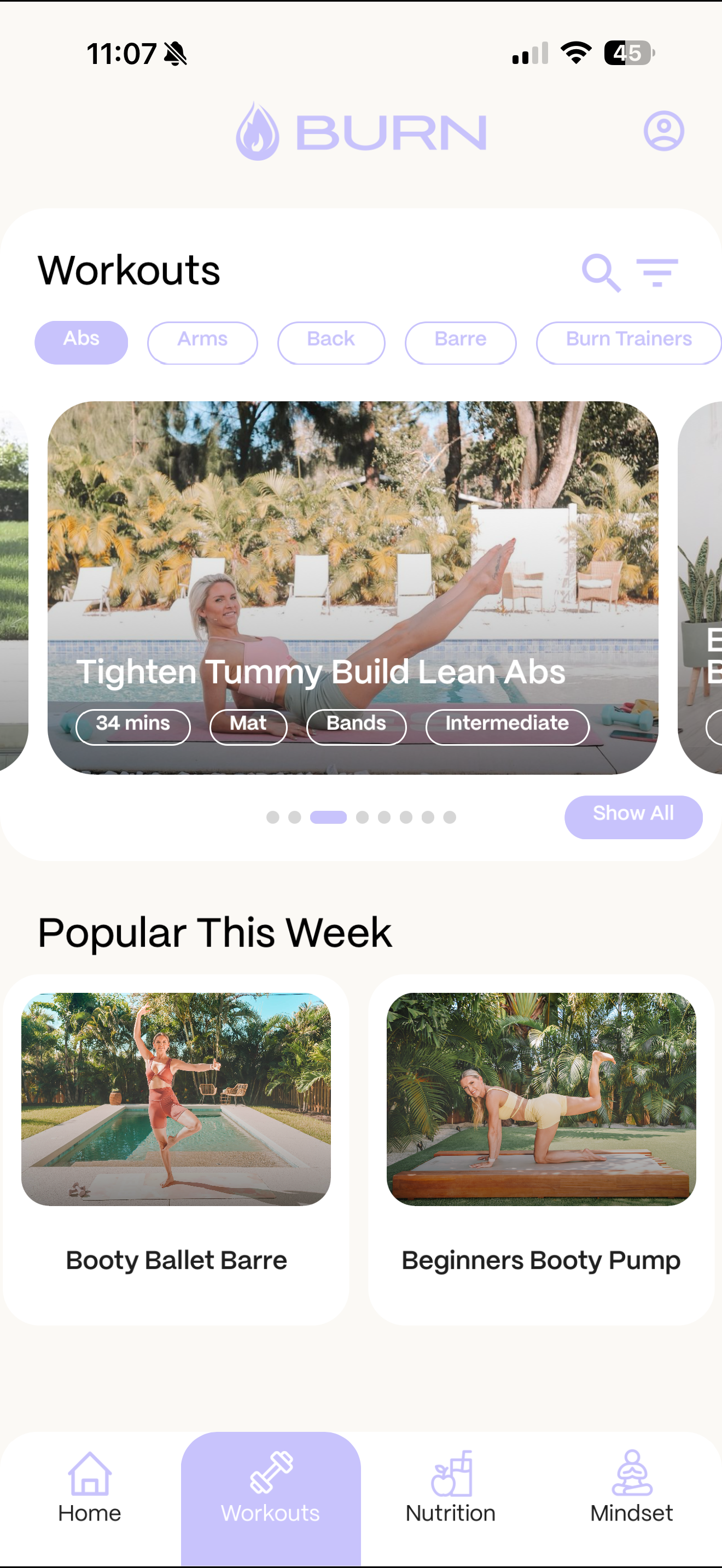 BURN app โ Workouts library with filter pills and Tighten Tummy Build Lean Abs workout